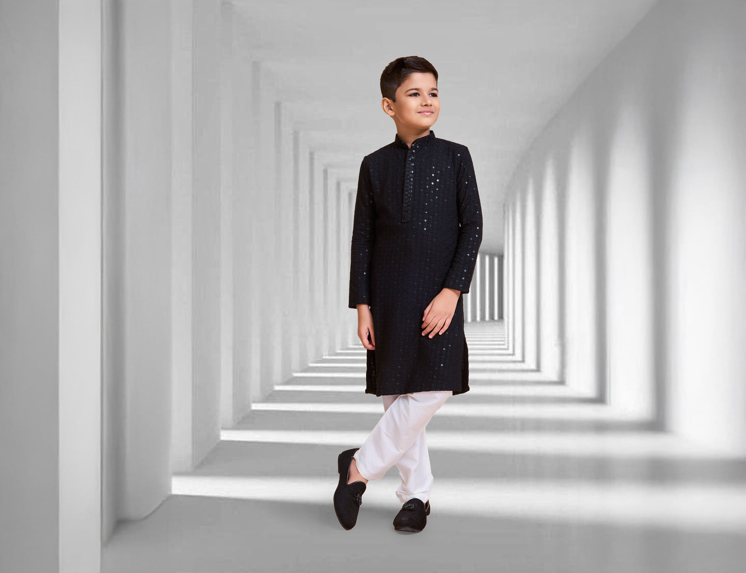Boy wearing a black chikankari kurta with sequins for function